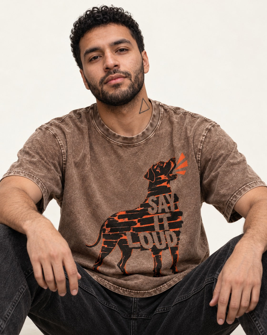 Great Dane Say It Loud Washed Tee in Coffee, worn by a seated model