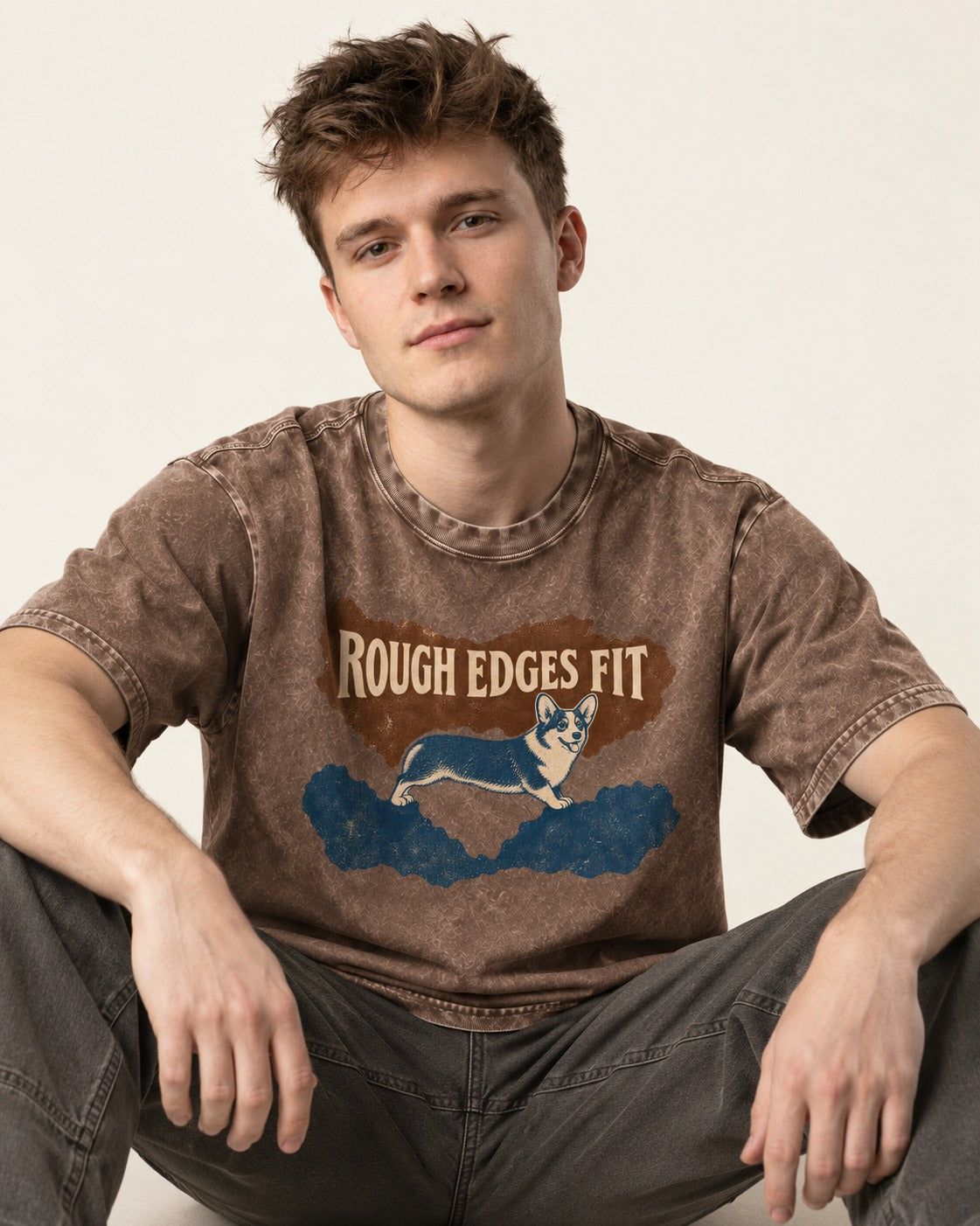 Corgi's Rough Edges Fit Washed Tee in Coffee, worn by a seated model