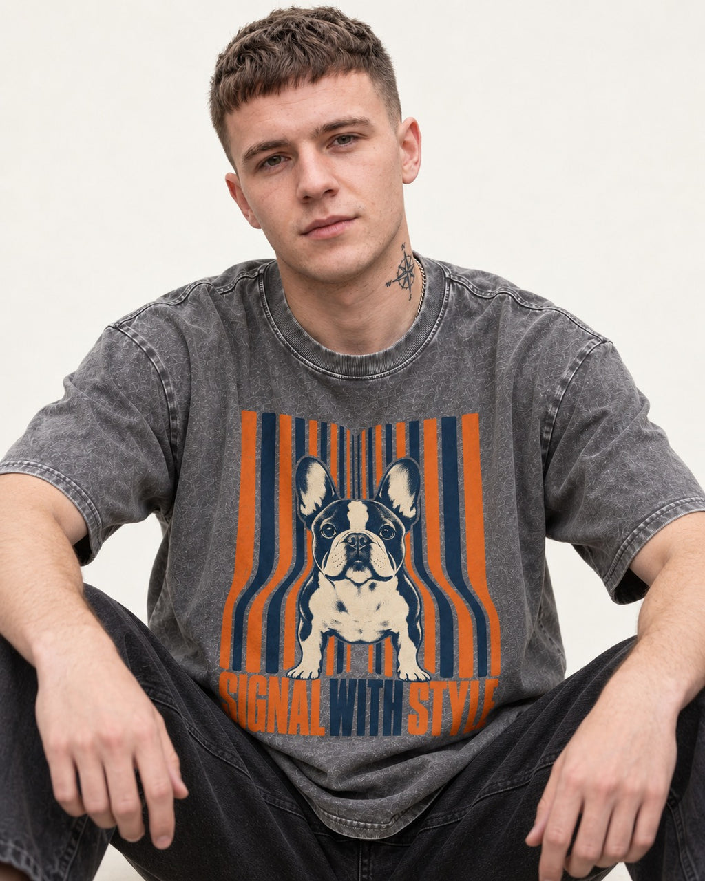 Frenchie Signal Washed Tee in Gray, worn by a seated model
