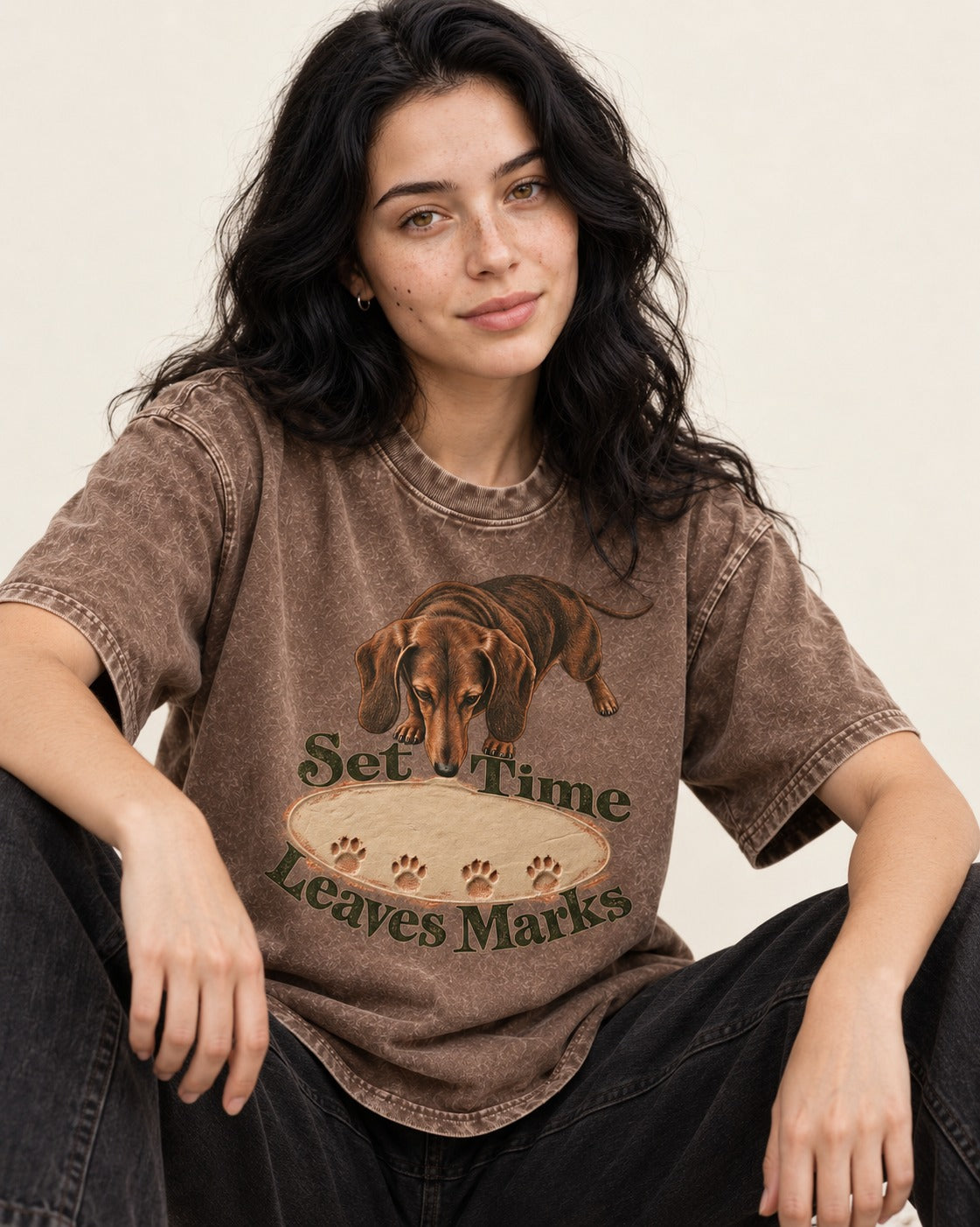 Dachshund Time Leaves Marks Washed Tee in Coffee, worn by a seated model