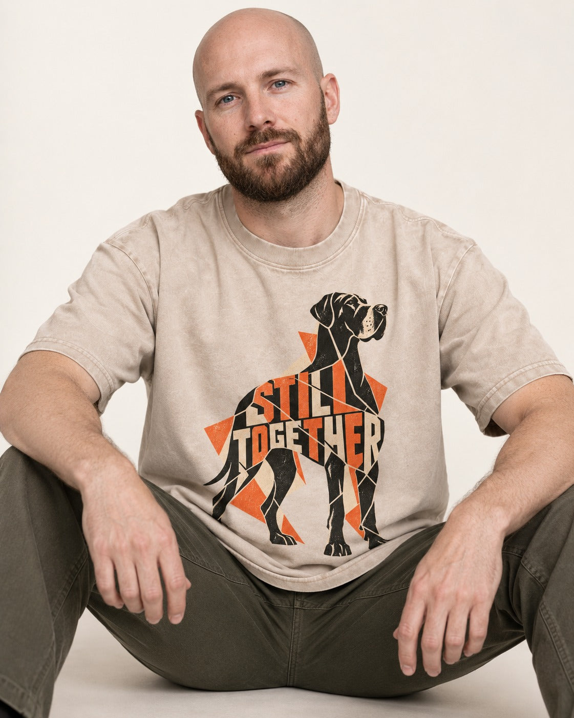 Great Dane Still Together Geometric Mosaic Graphic Washed Tee in Apricot, worn by a seated model