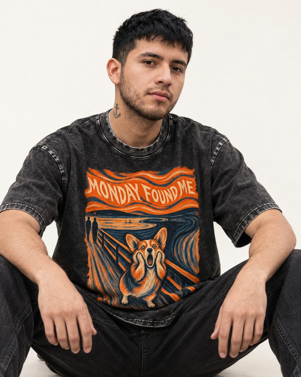 Corgi Monday Found Me Scream Banner Washed Tee in Black, worn by a seated model