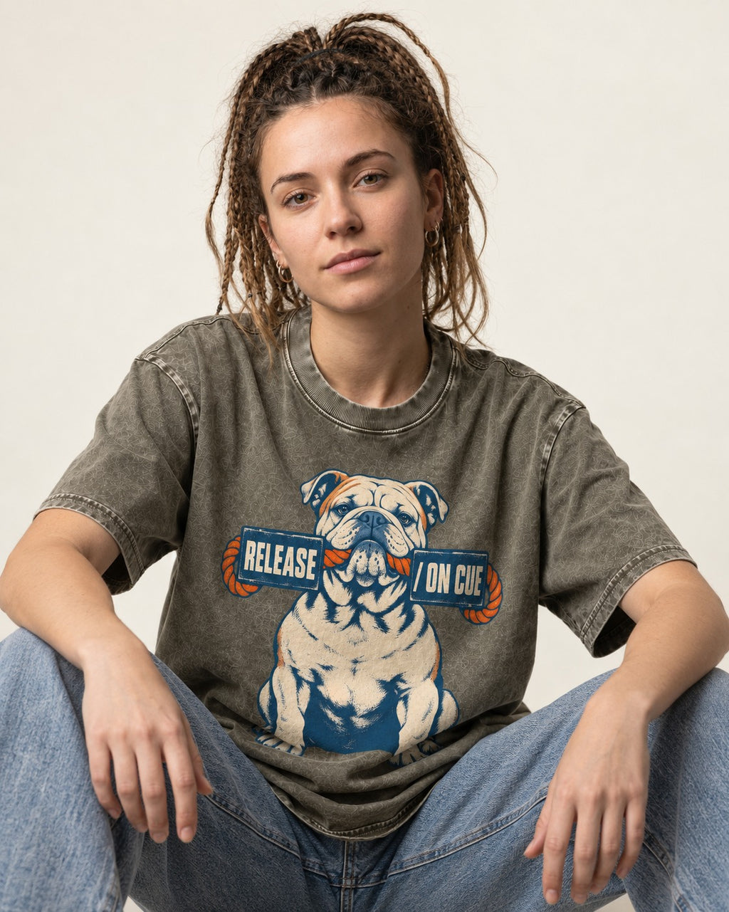 English Bulldog Release on Cue Rope Sign Graphic Washed Tee in Army Green, worn by a seated model