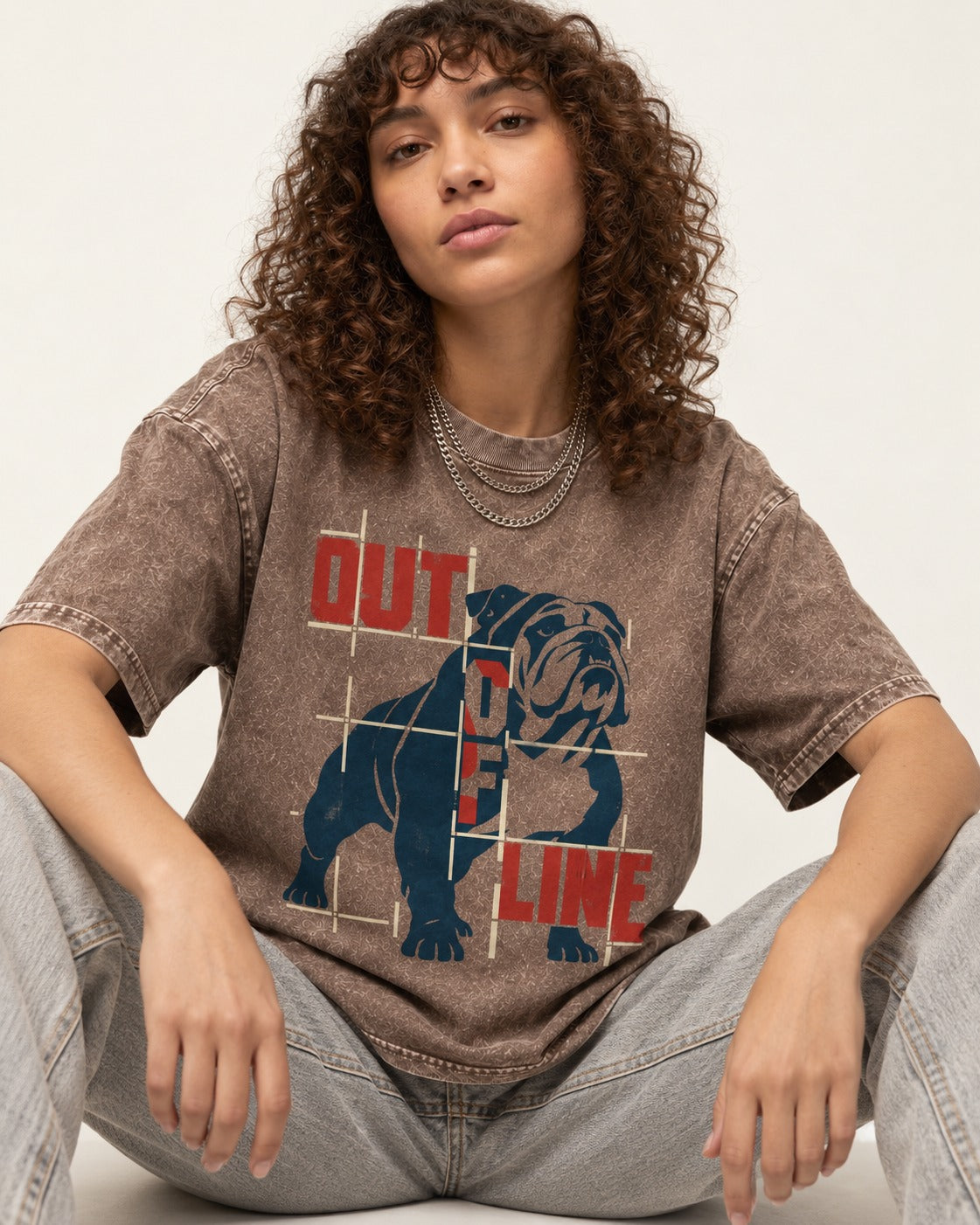 English Bulldog Out of Line Washed Tee in Coffee, worn by a seated model