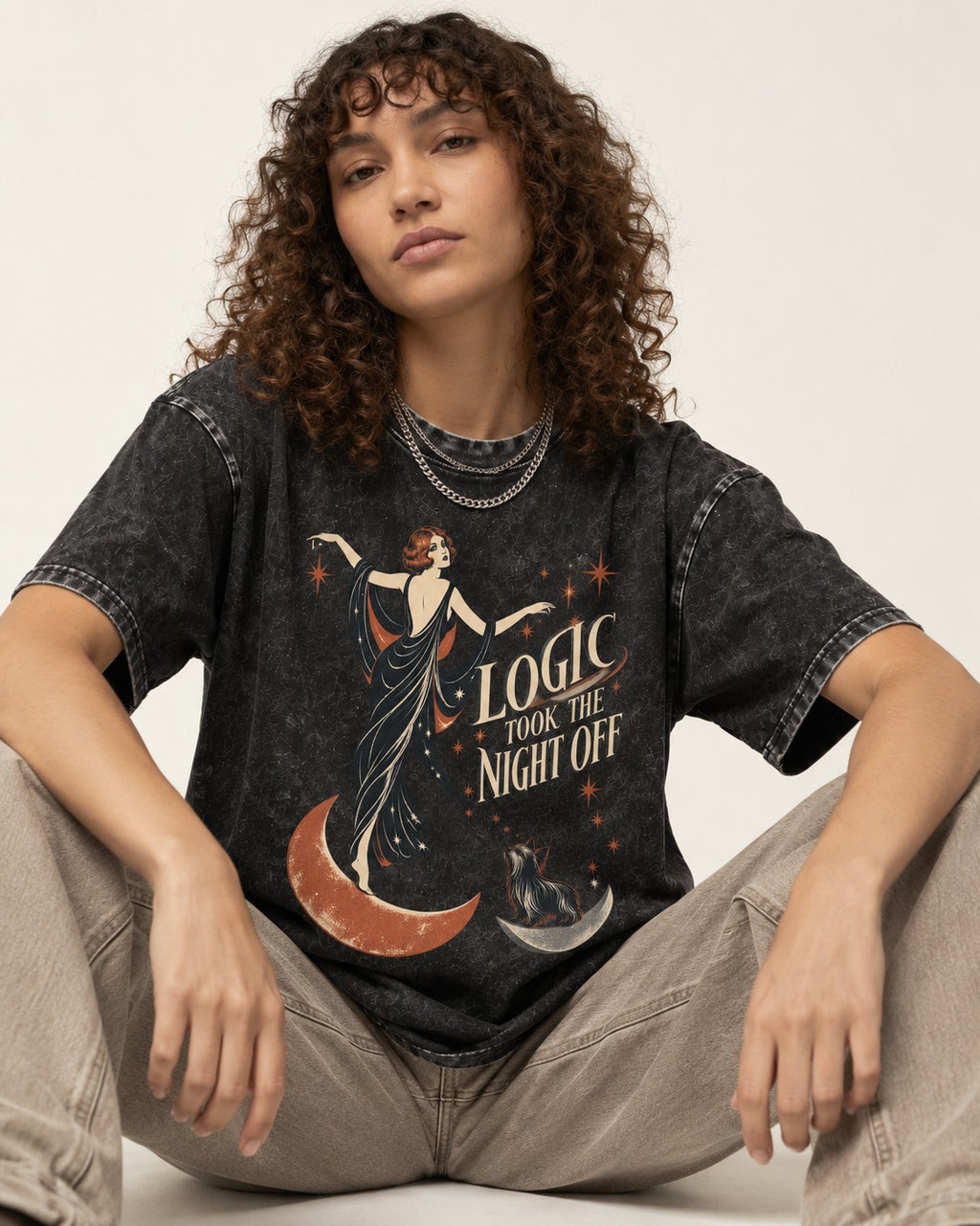 Yorkshire Terrier Logic Took the Night Off Art Deco Graphic Washed Tee in Black, worn by a seated model