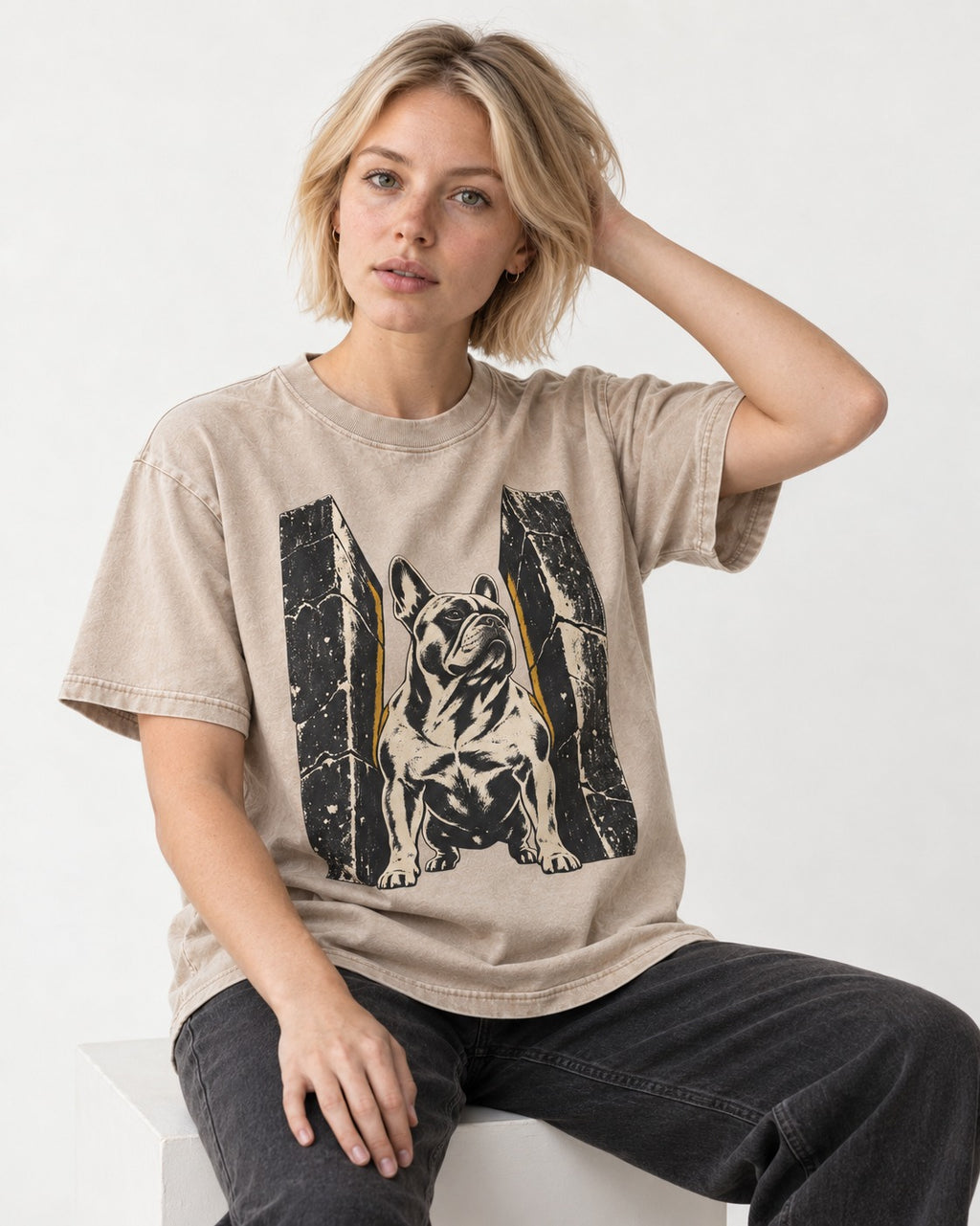 Frenchie Unbreakable Washed Tee in Apricot, worn by a seated model