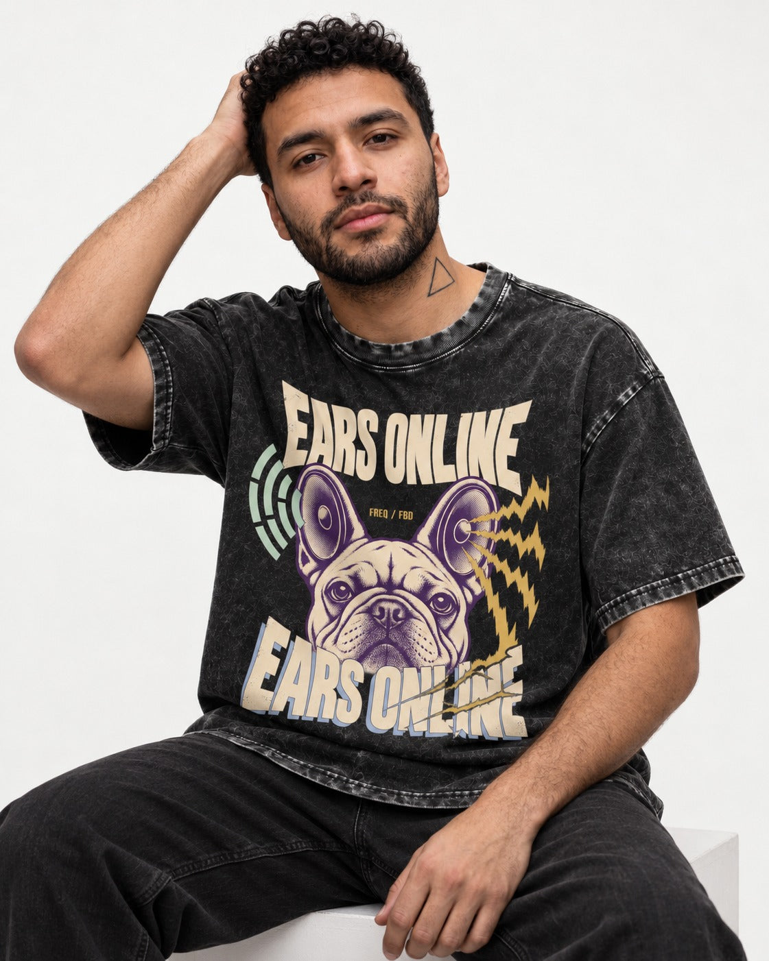 Frenchie Ears Online Audio Signal Graphic Washed Tee in Black, worn by a seated model