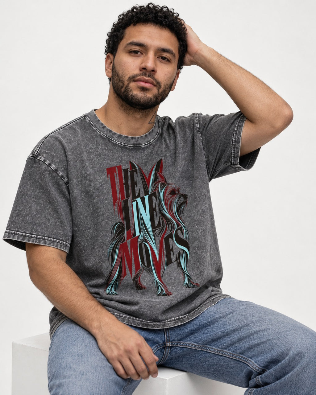 The One Moves Yorkshire Terrier Washed Tee in Gray, worn by a seated model