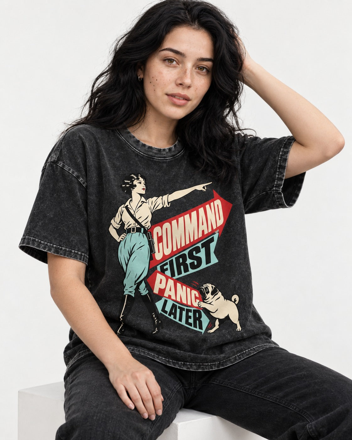 Pug Command First Panic Later Directional Graphic Washed Tee in Black, worn by a seated model