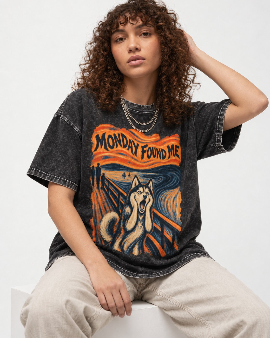 Husky Monday Found Me Scream Parody Graphic Washed Tee in Black, worn by a seated model