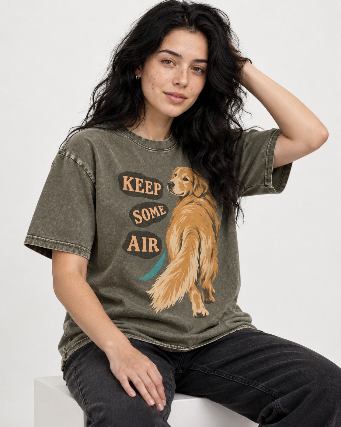 Golden Retriever Keep Some Air Looking Back Graphic Washed Tee in Army Green, worn by a seated model