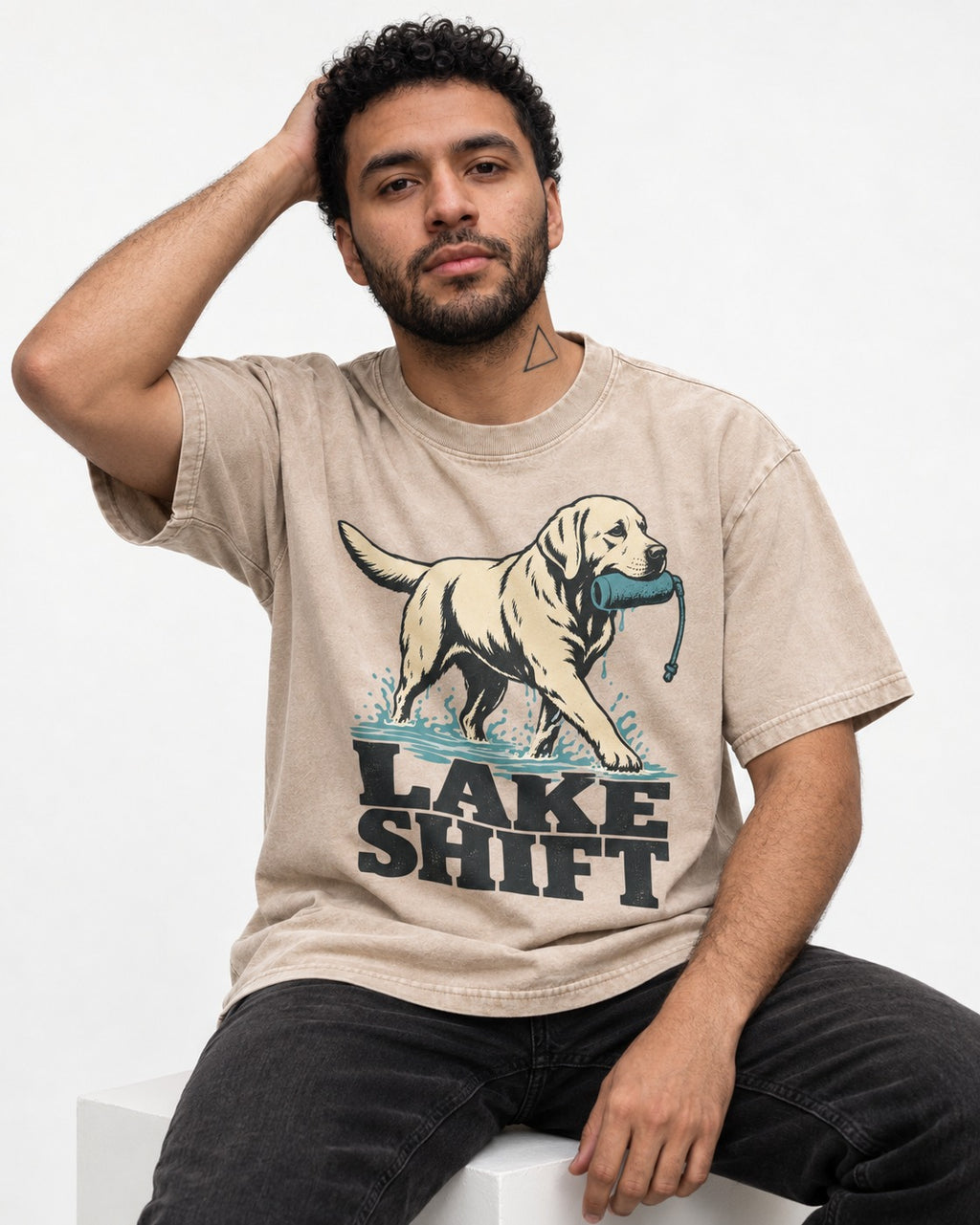 Lake Shift Labrador Retriever Washed Tee in Apricot, worn by a seated model
