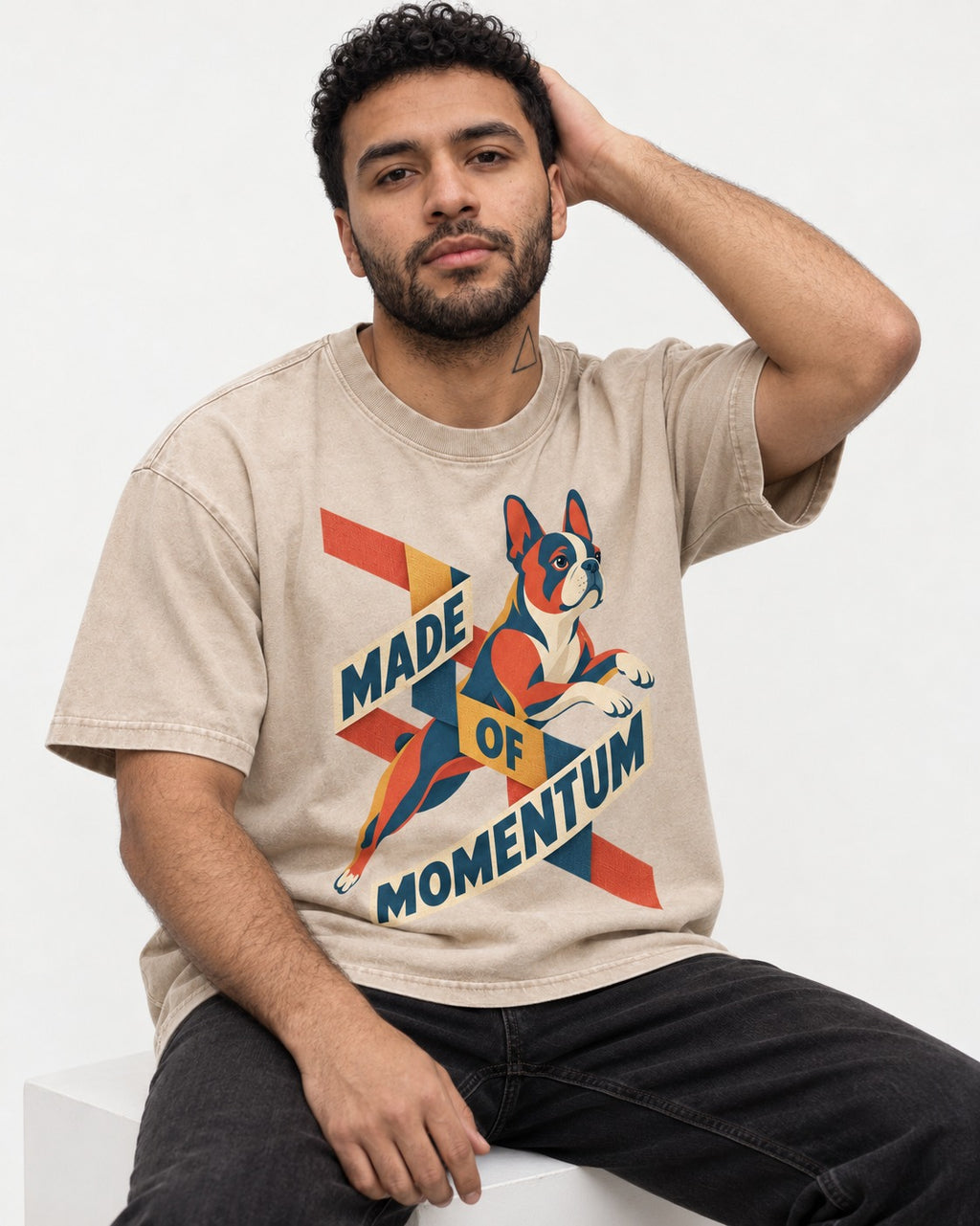 Made of Momentum Boston Terrier Washed Tee in Apricot, worn by a seated model