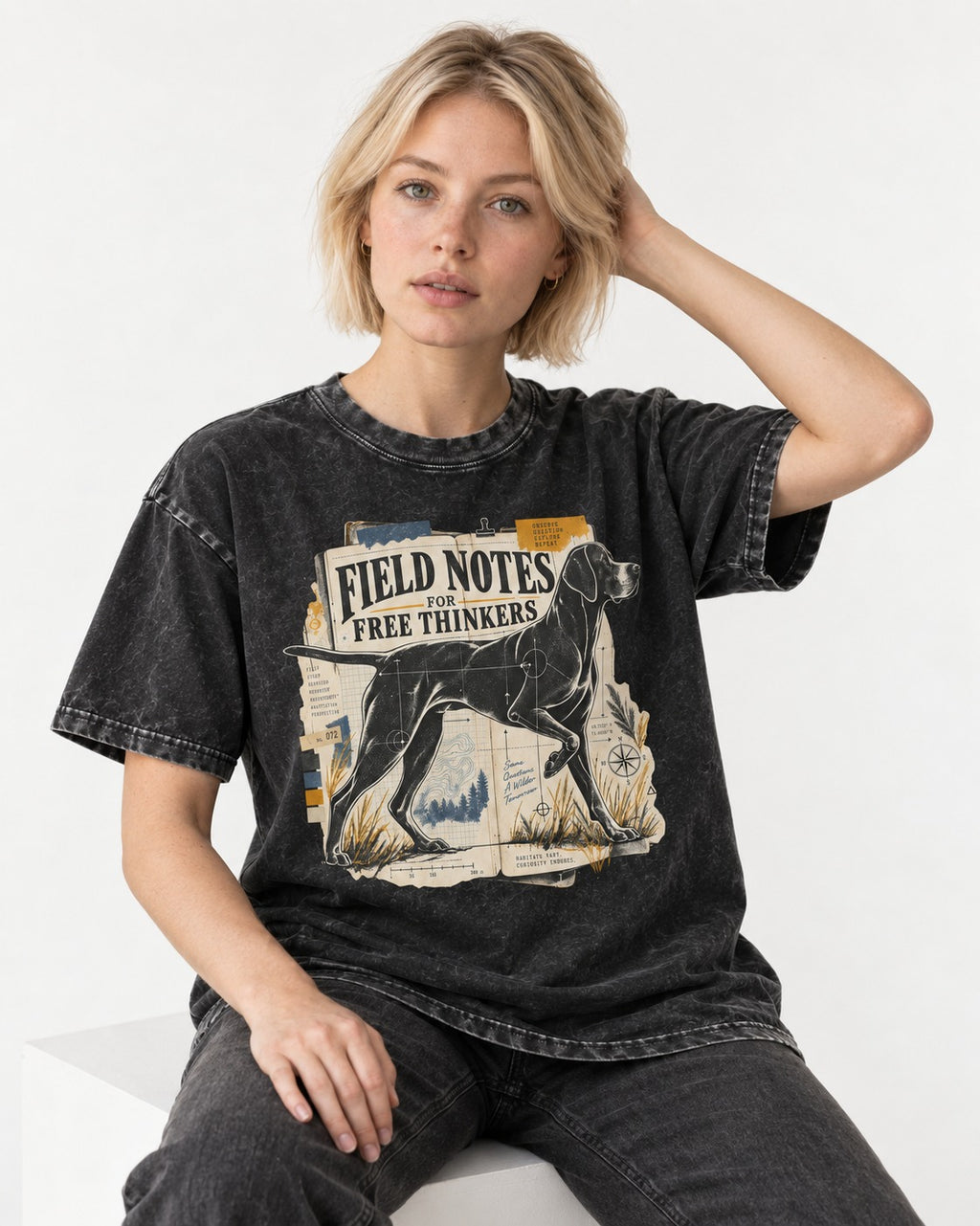Field Notes for Free Thinkers Collage German Shorthaired Pointer Graphic Washed Tee in Black, worn by a seated model