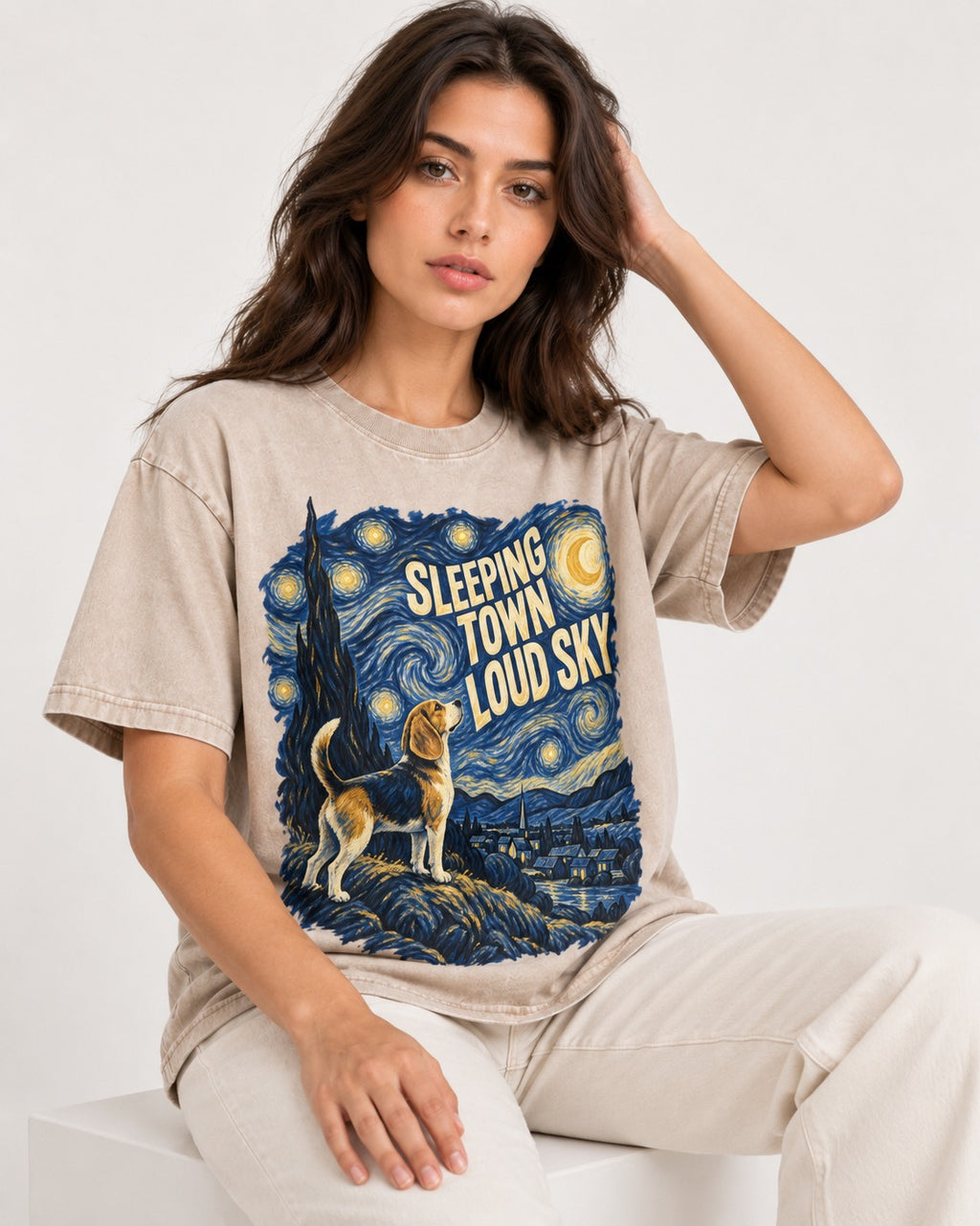 Sleeping Town Loud Sky Beagle Nightscape Washed Tee in Apricot, worn by a seated model