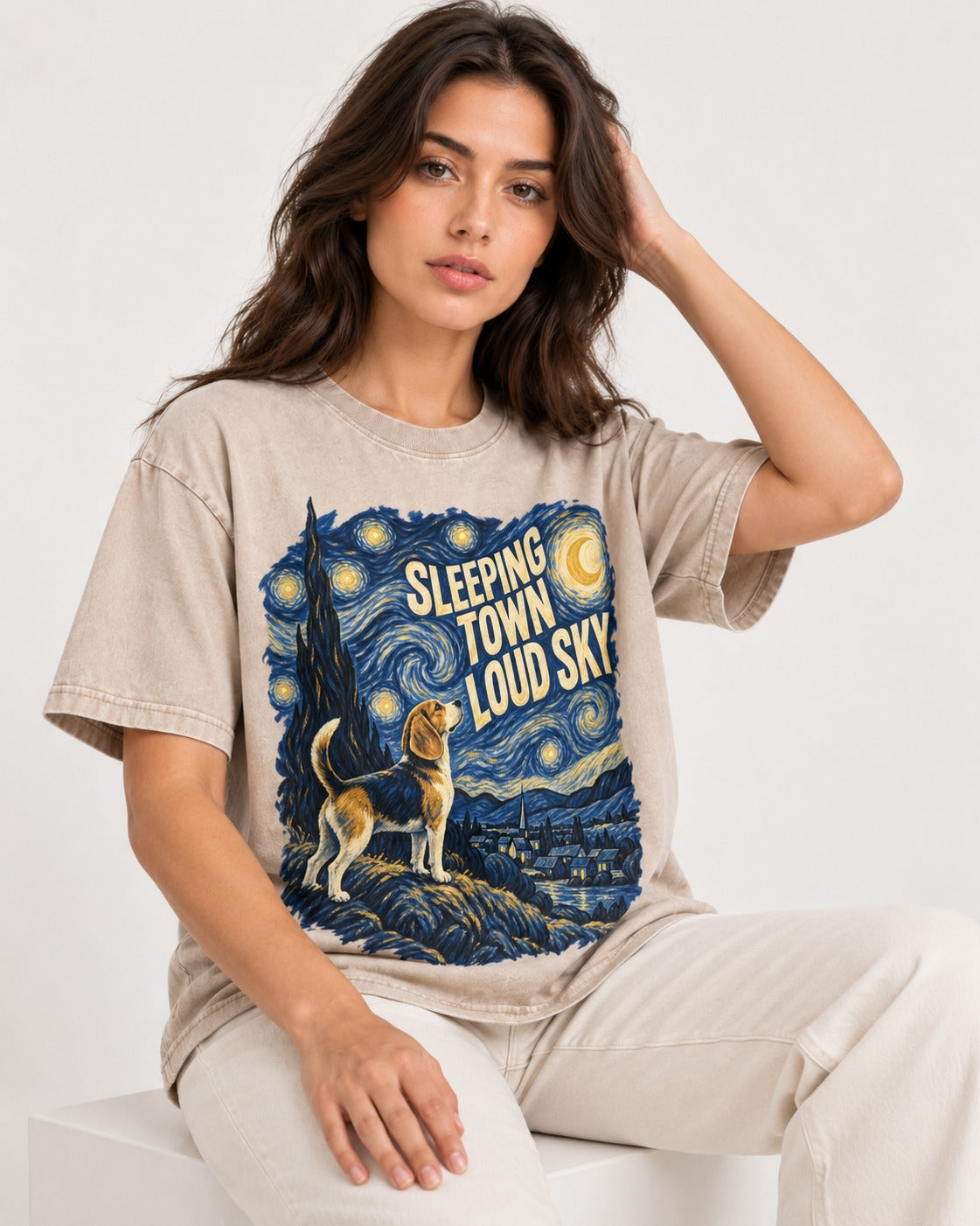 Sleeping Town Loud Sky Beagle Nightscape Washed Tee in Apricot, worn by a seated model