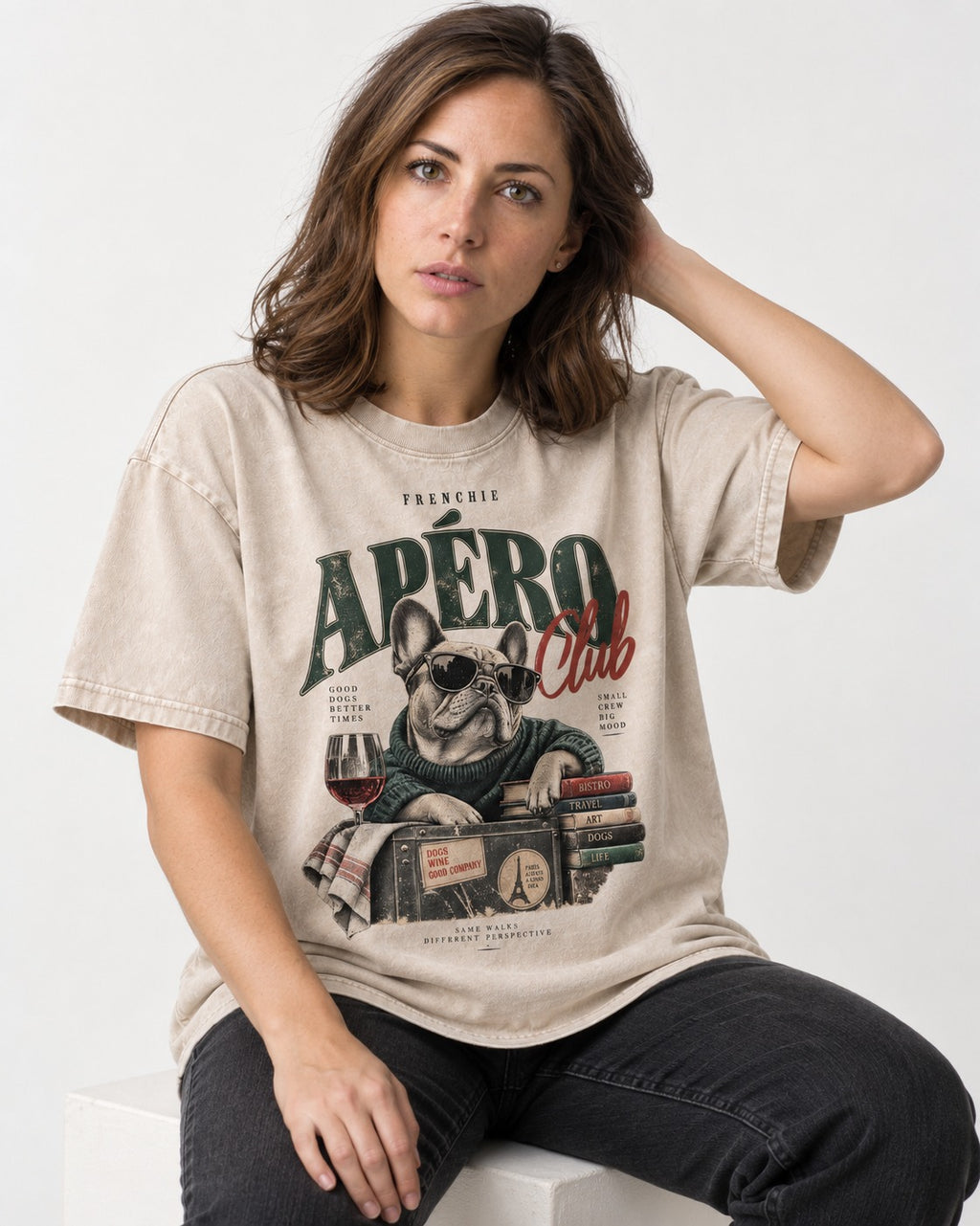 Frenchie Apero Club Washed Tee in Apricot, worn by a seated model