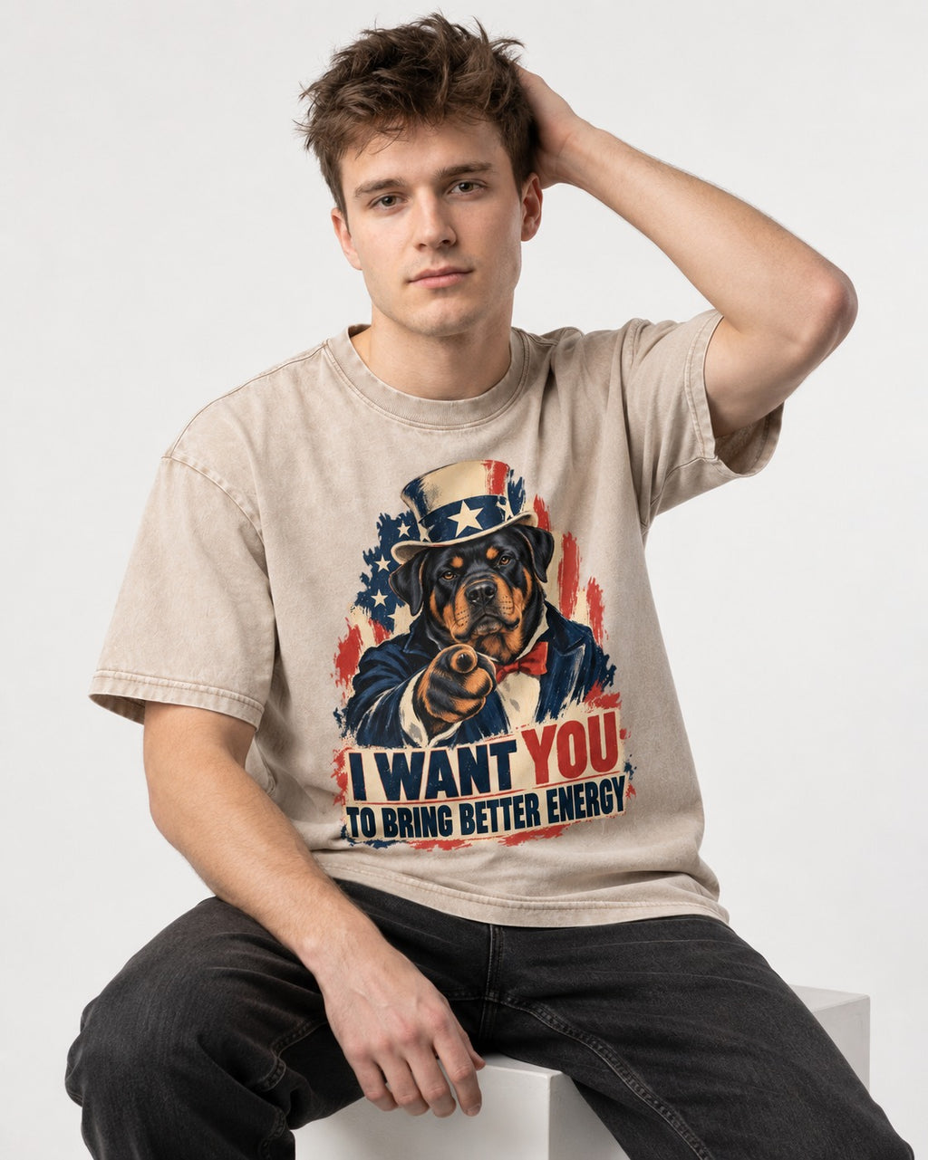 Rottweiler I Want You to Bring Better Energy Recruitment Poster Graphic Washed Tee in Apricot, worn by a seated model