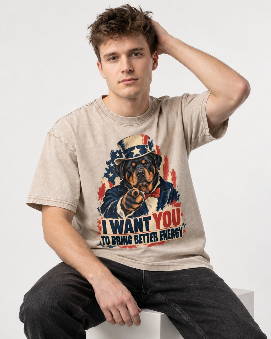 Rottweiler I Want You to Bring Better Energy Recruitment Poster Graphic Washed Tee in Apricot, worn by a seated model
