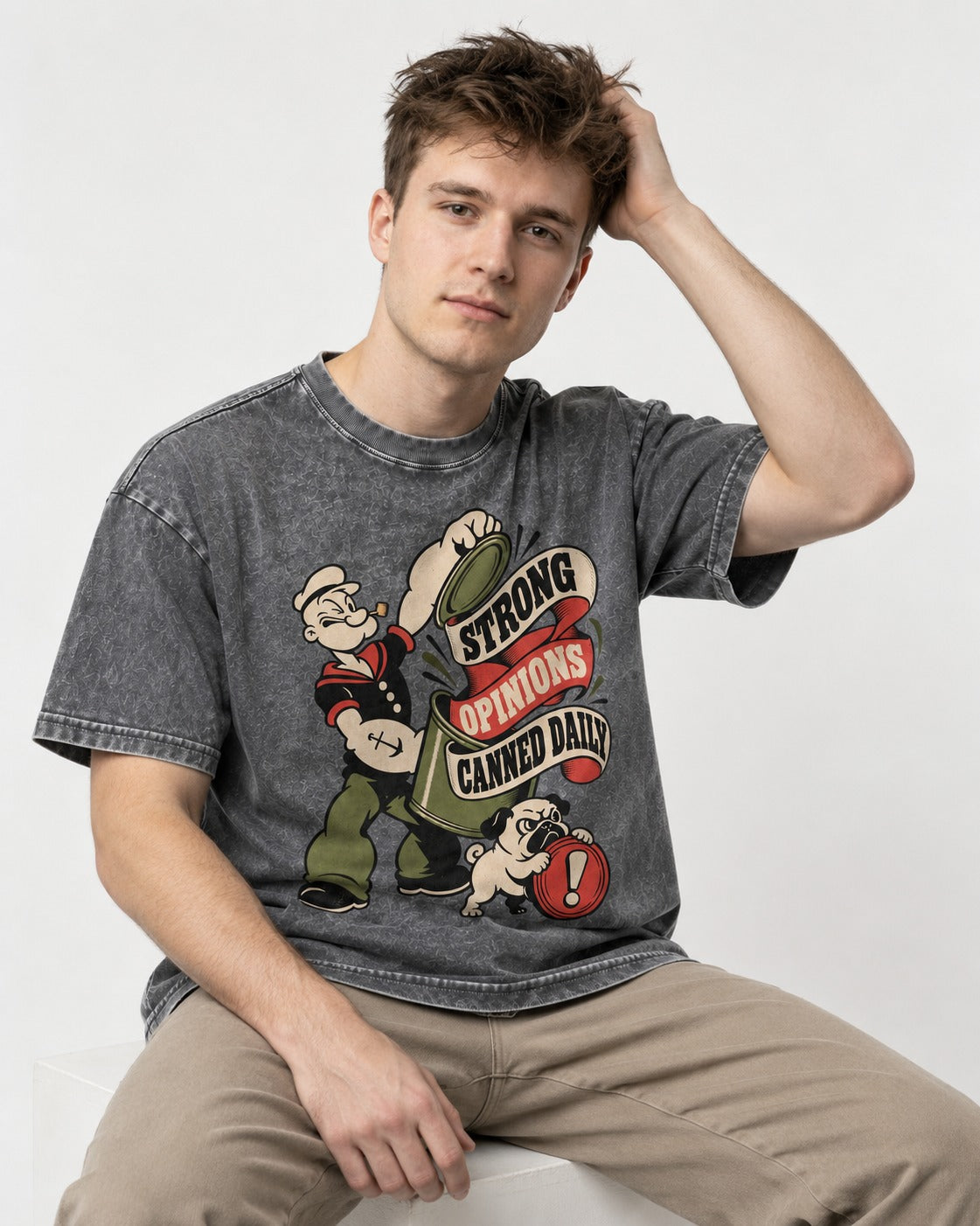 Pug Strong Opinions Washed Tee in Gray, worn by a seated model