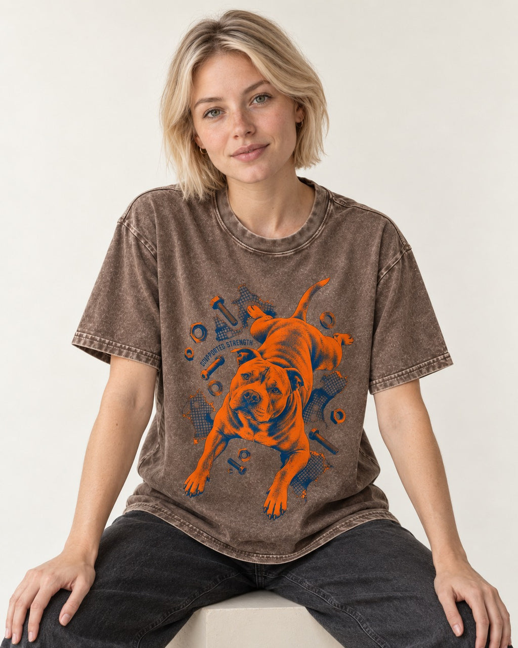 Pitbull Strength Washed Tee in Coffee, worn by a seated model