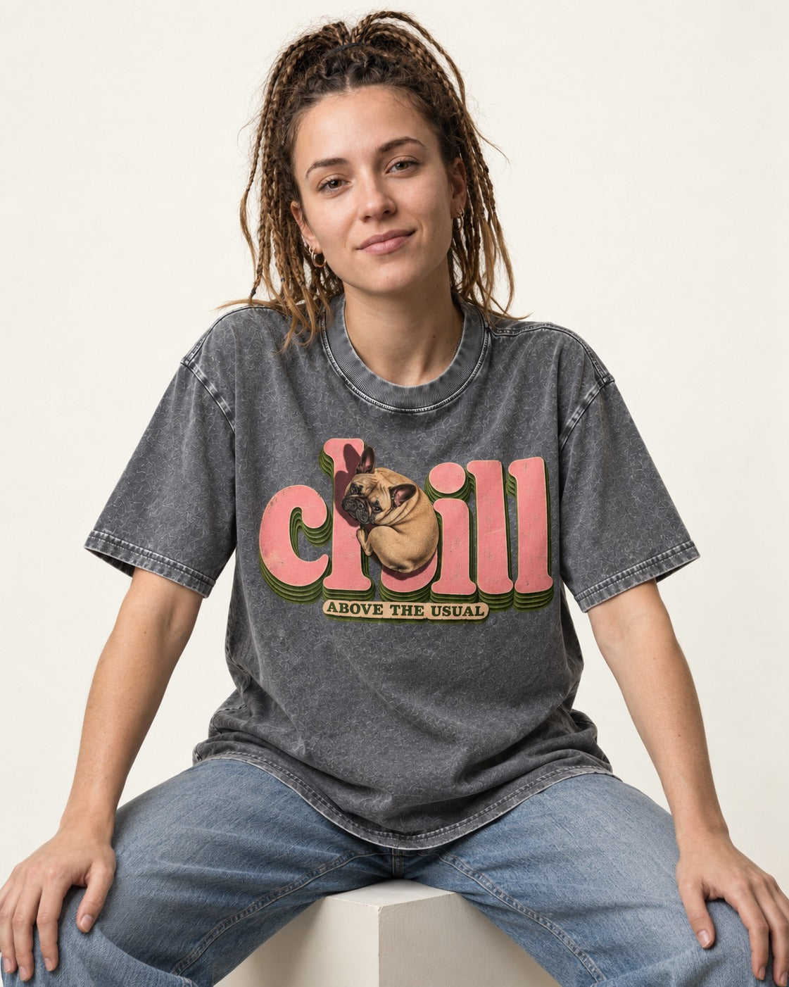 Frenchie Chill Washed Tee in Gray, worn by a seated model