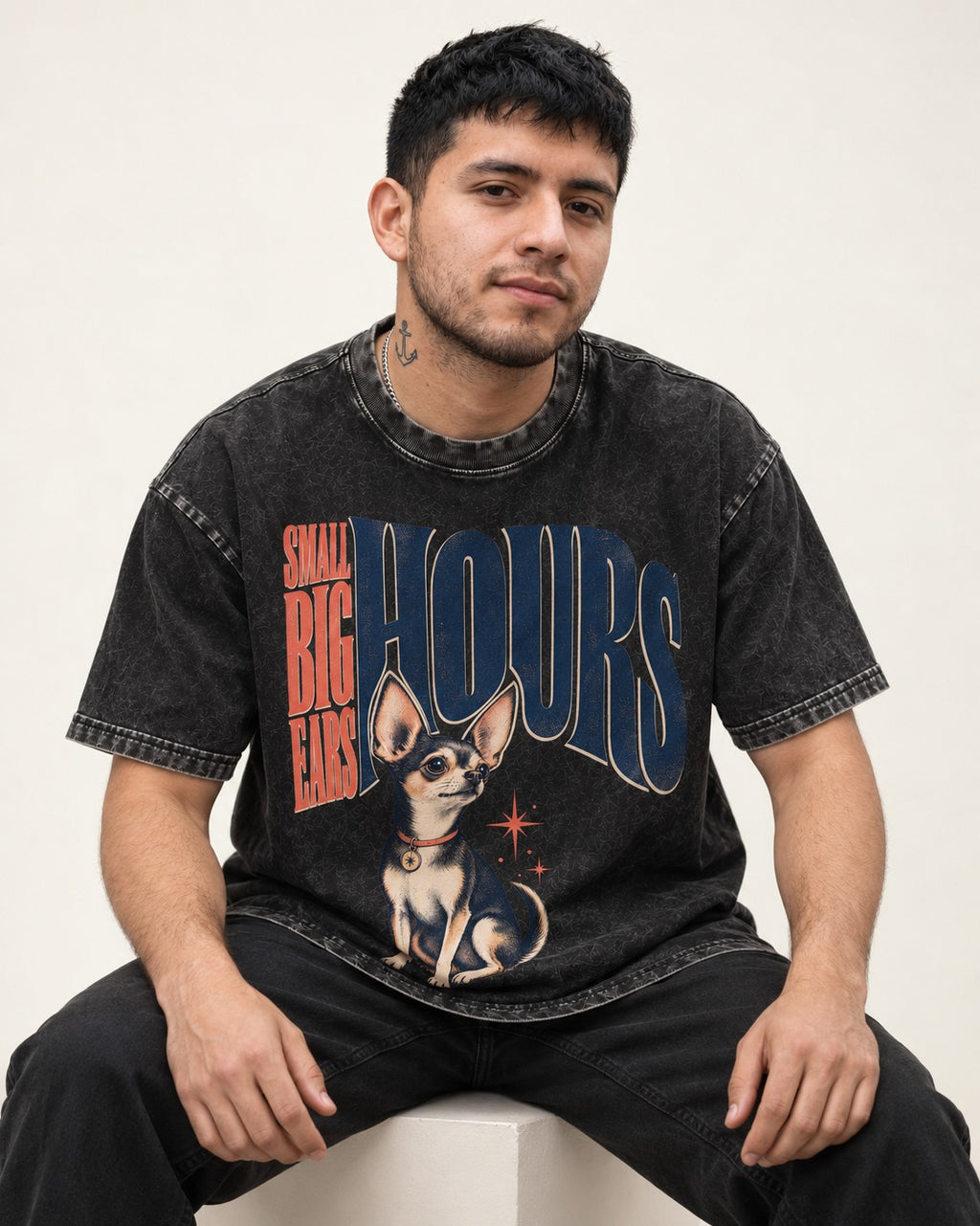Chihuahua Small Big Ears Hours Washed Tee in Black, worn by a seated model