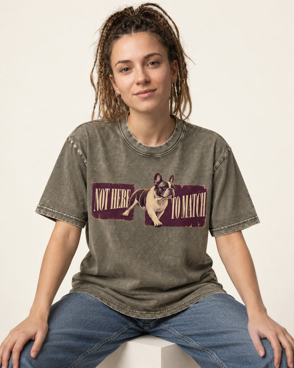 Frenchie Not Here to Watch Panels Graphic Washed Tee in Army Green, worn by a seated model