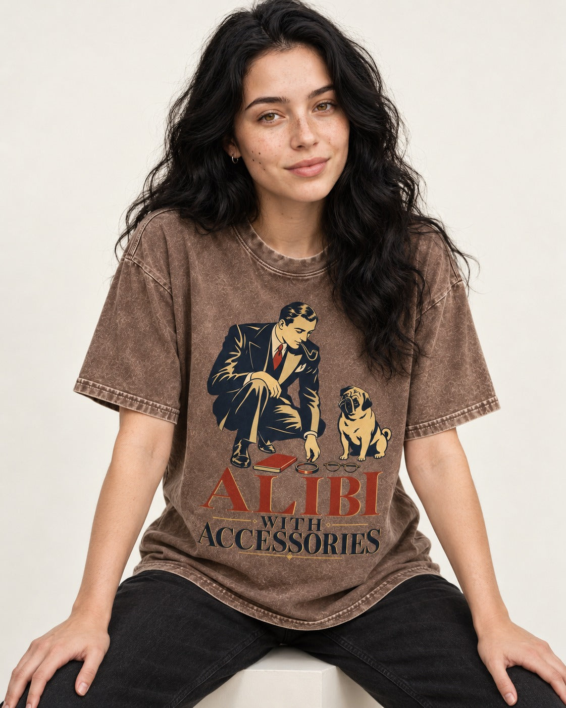 Pug Alibi with Accessories Washed Tee in Coffee, worn by a seated model