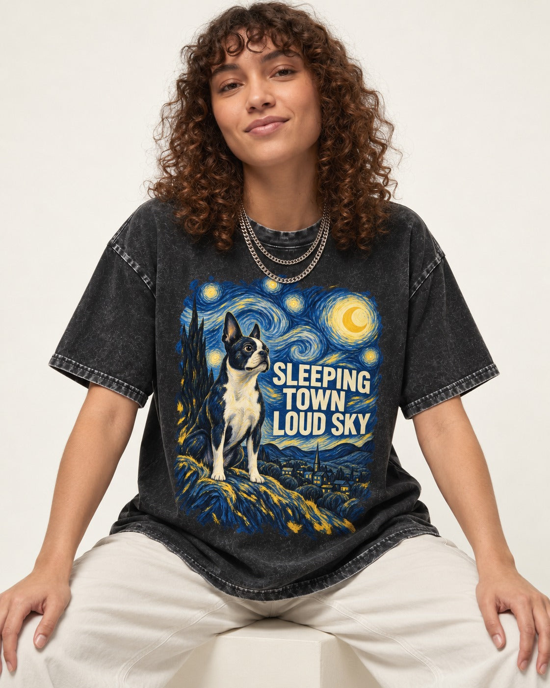 Sleeping Town Loud Sky Boston Terrier Starry Night Washed Tee in Black, worn by a seated model
