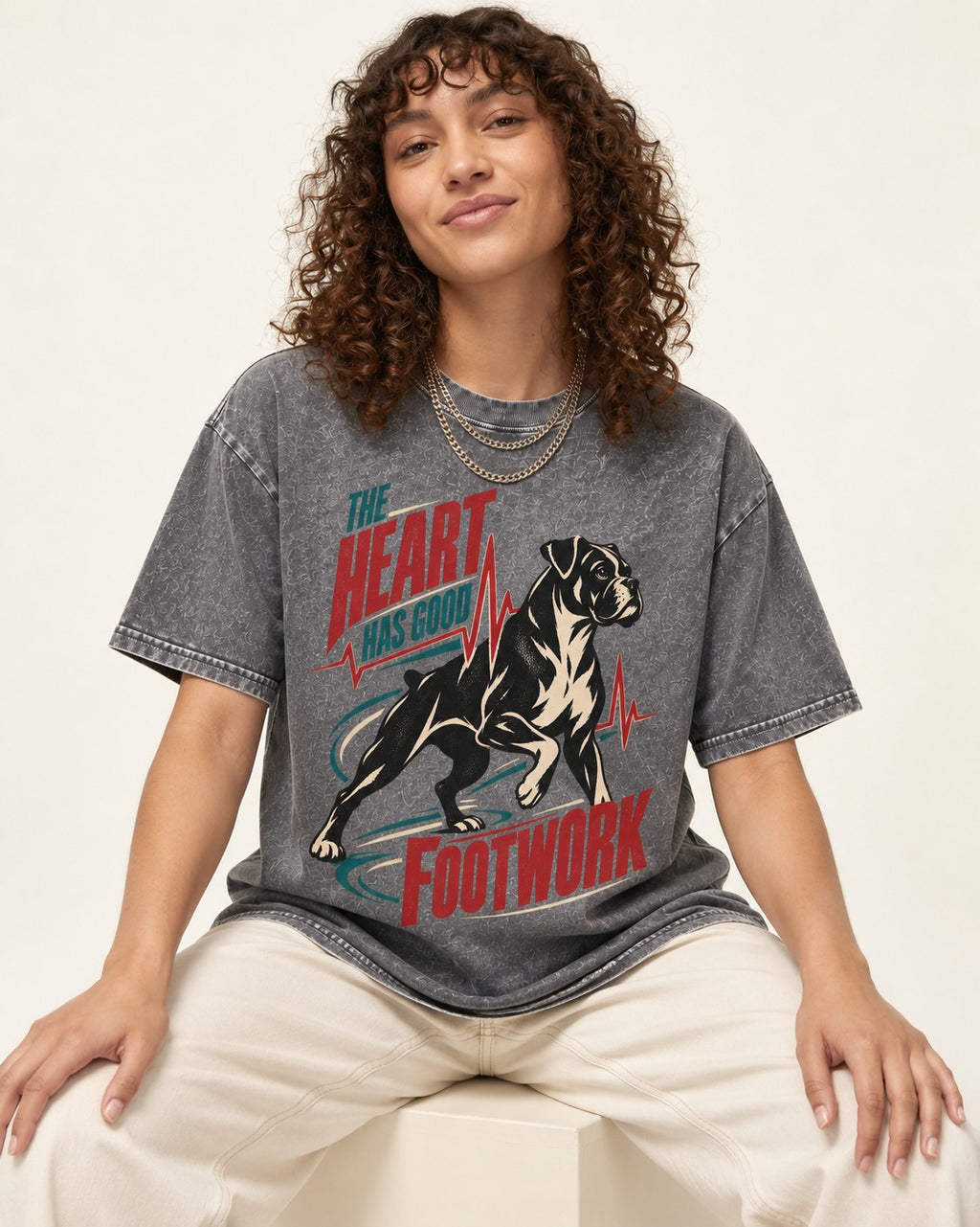 Boxer Heart Has Good Footwork Washed Tee in Gray, worn by a seated model