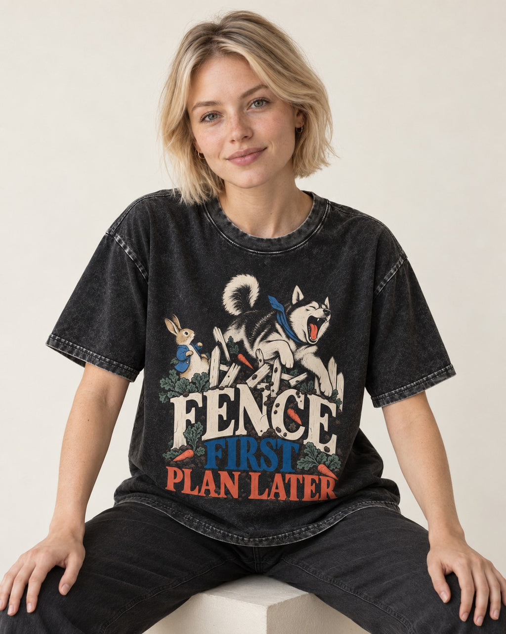 Husky Fence First Plan Later Garden Escape Graphic Washed Tee in Black, worn by a seated model