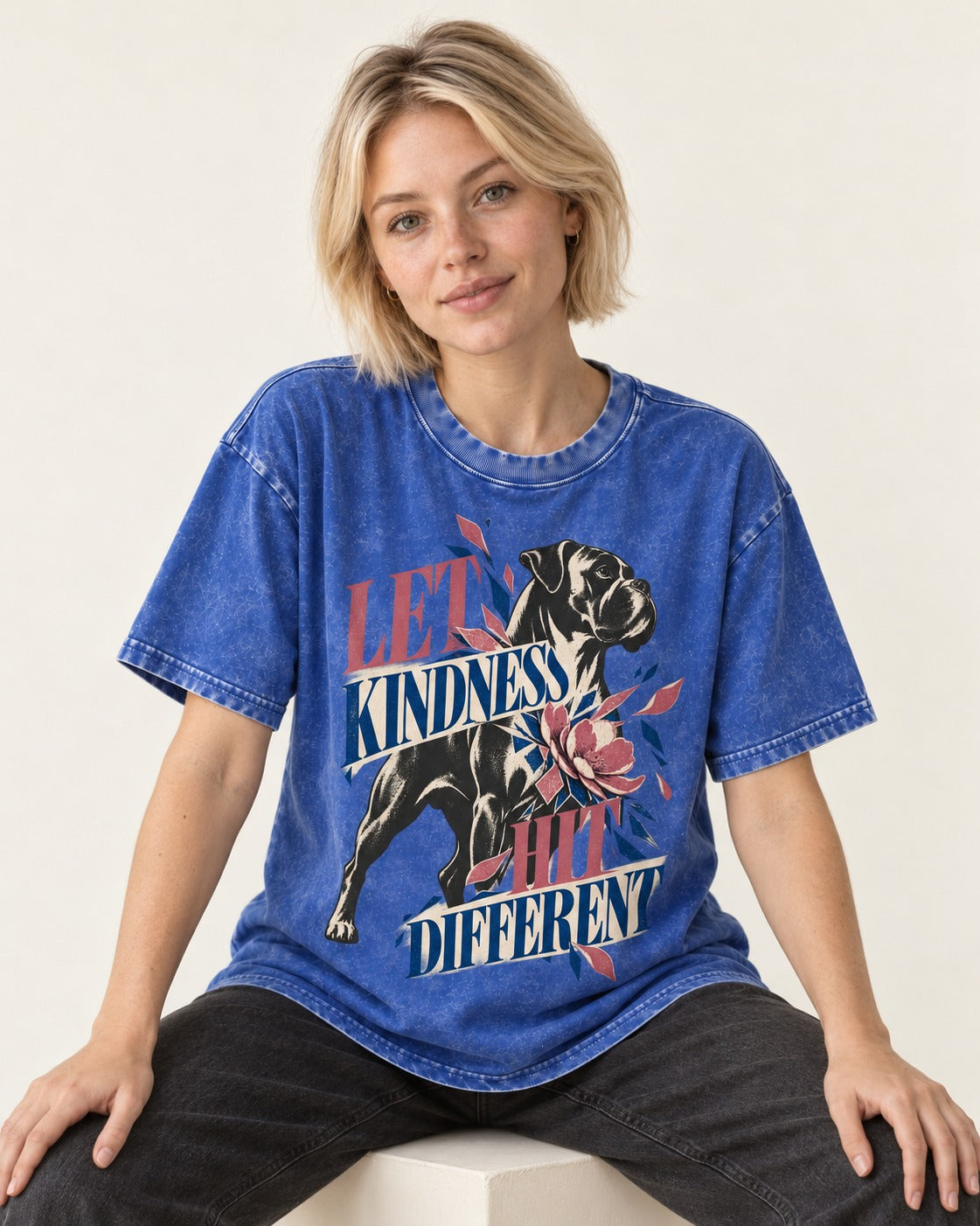 Let Kindness Hit Different Boxer Floral Collage Washed Tee in Royal Blue, worn by a seated model