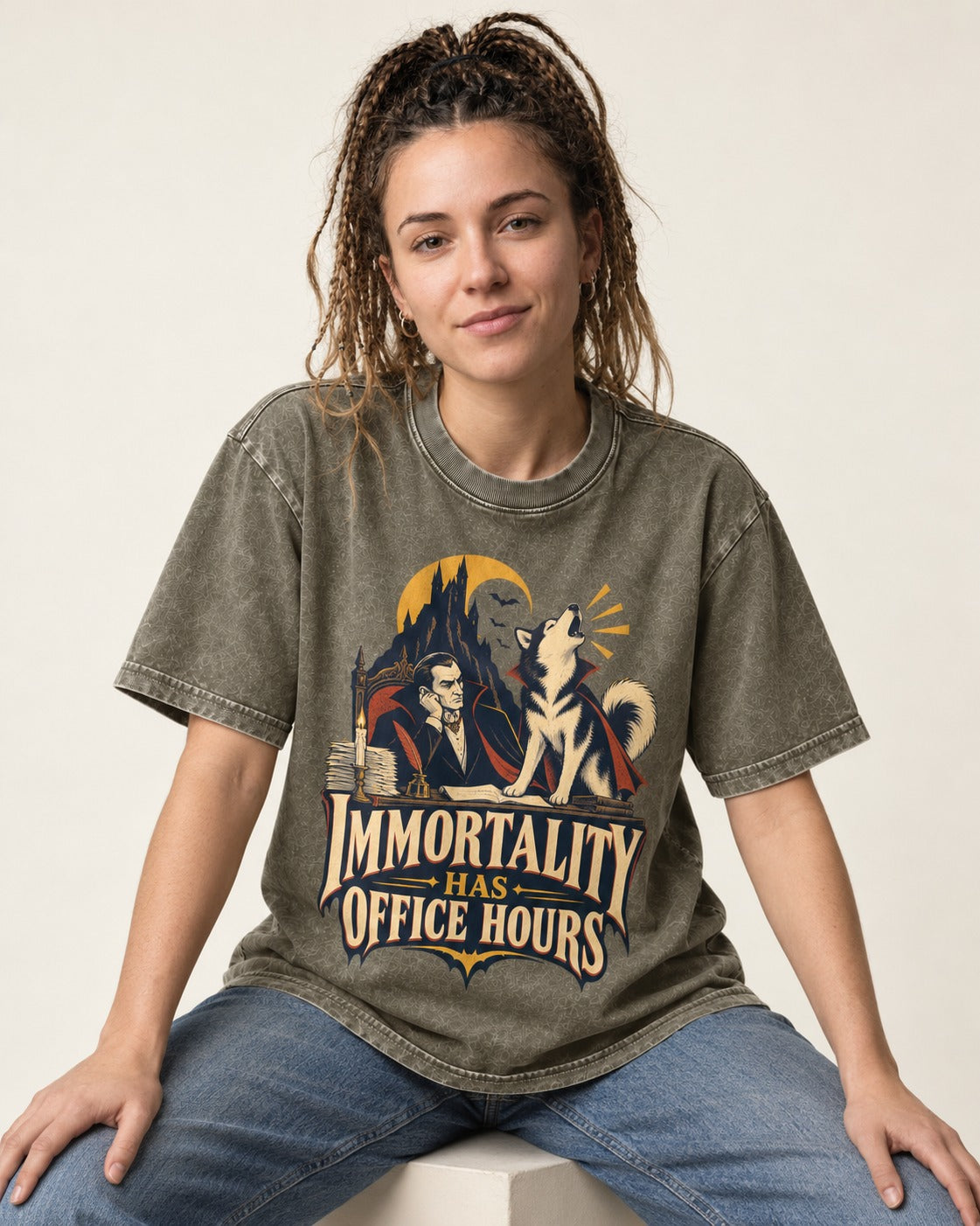 Husky Immortality Has Office Hours Vampire Office Graphic Washed Tee in Army Green, worn by a seated model