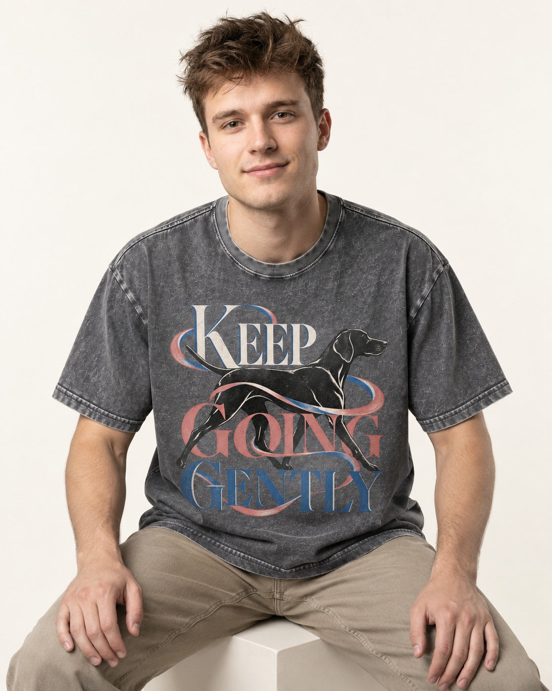 German Shorthaired Pointer Keep Going Gently Walking Graphic Washed Tee in Gray, worn by a seated model