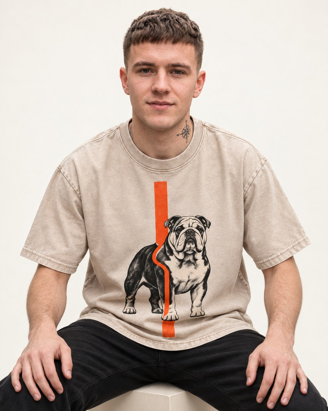 English Bulldog Quiet Strength Washed Tee in Apricot, worn by a seated model