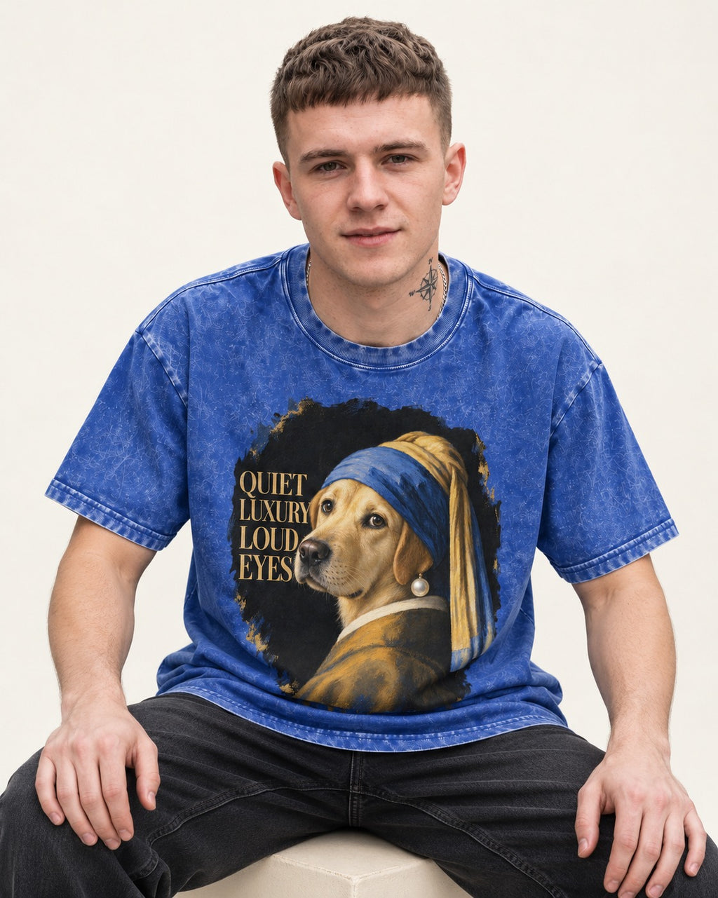 Labrador Retriever Quiet Luxury Loud Eyes Pearl Earring Graphic Washed Tee in Royal Blue, worn by a seated model