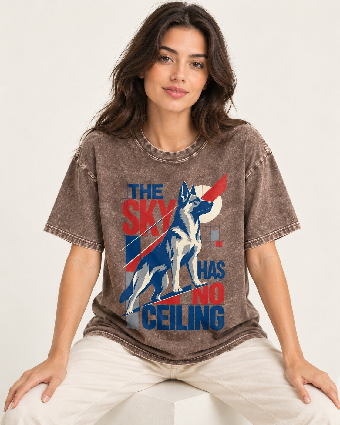 Sky Has No Ceiling German Shepherd Dog Washed Tee in Coffee, worn by a seated model