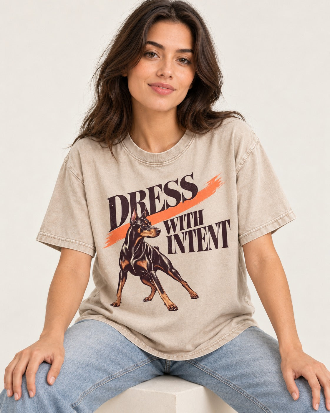 Doberman Dress with Intent Washed Tee in Apricot, worn by a seated model