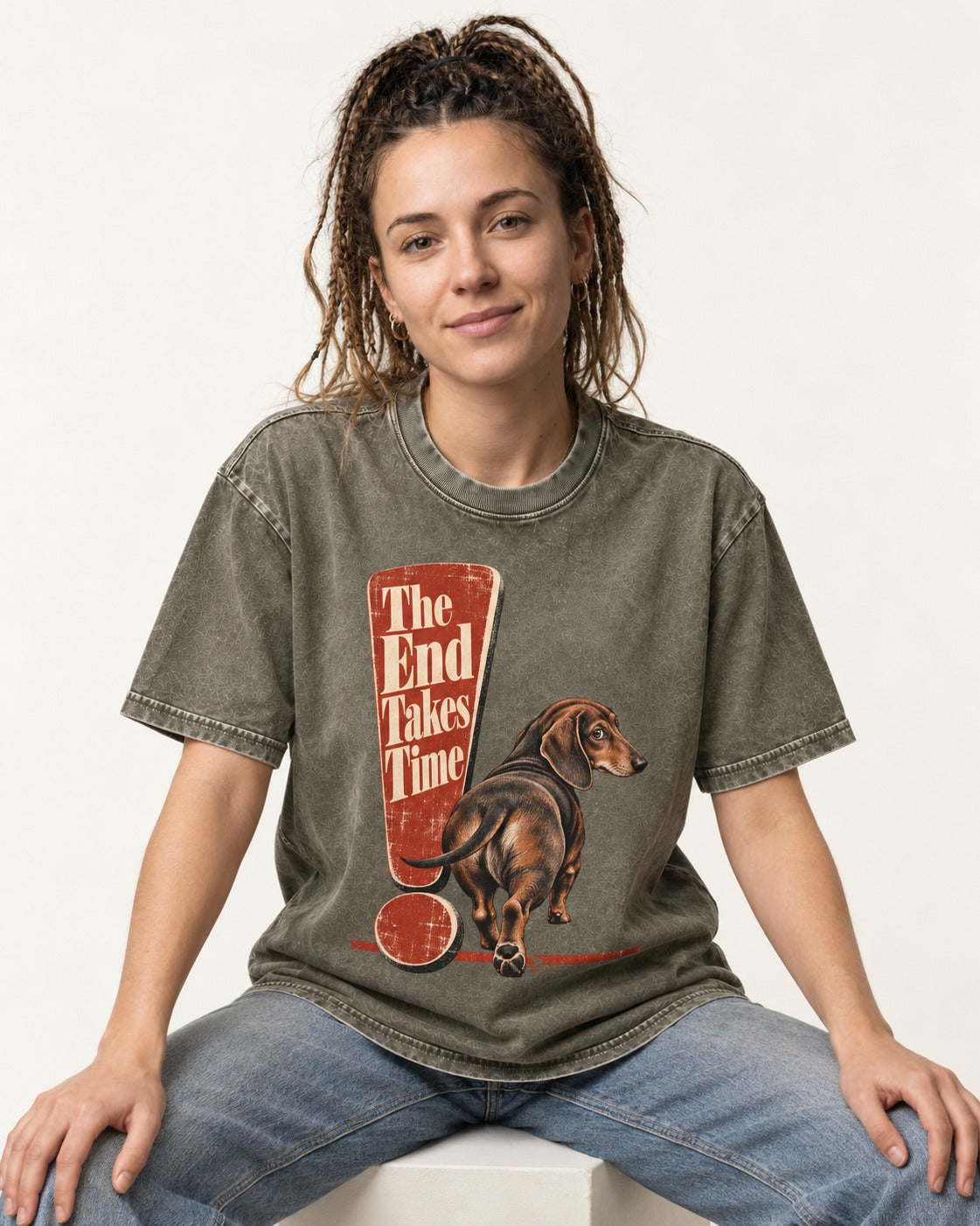 Dachshund The End Takes Time Exclamation Mark Graphic Washed Tee in Army Green, worn by a seated model