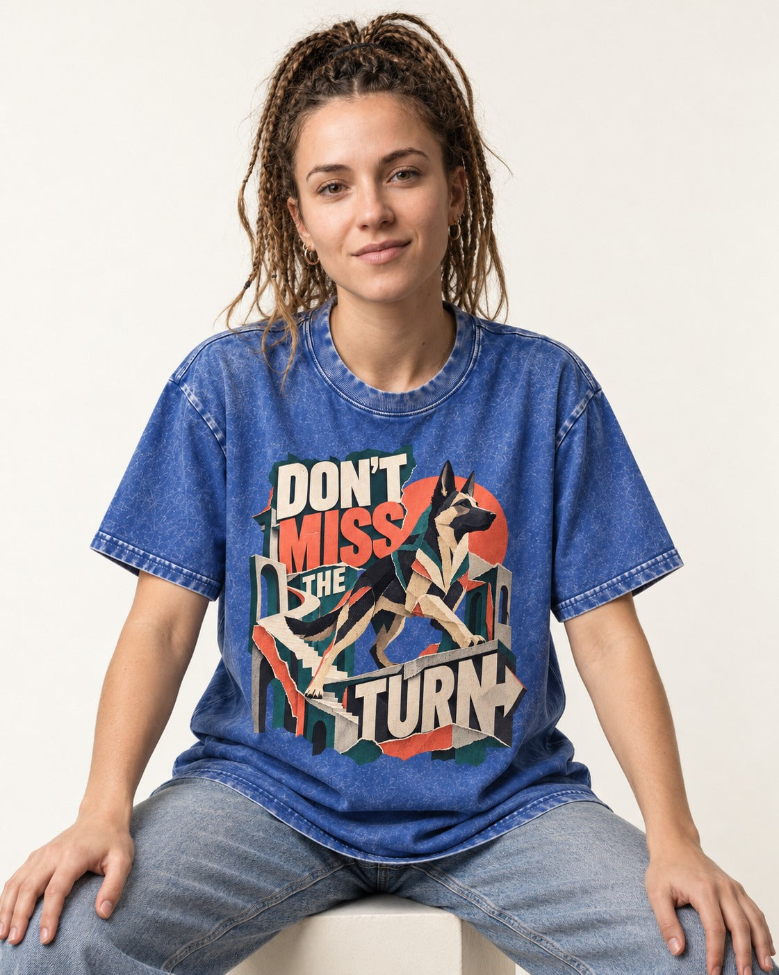 Dont Miss The Turn Escher Staircase German Shepherd Dog Graphic Washed Tee in Royal Blue, worn by a seated model