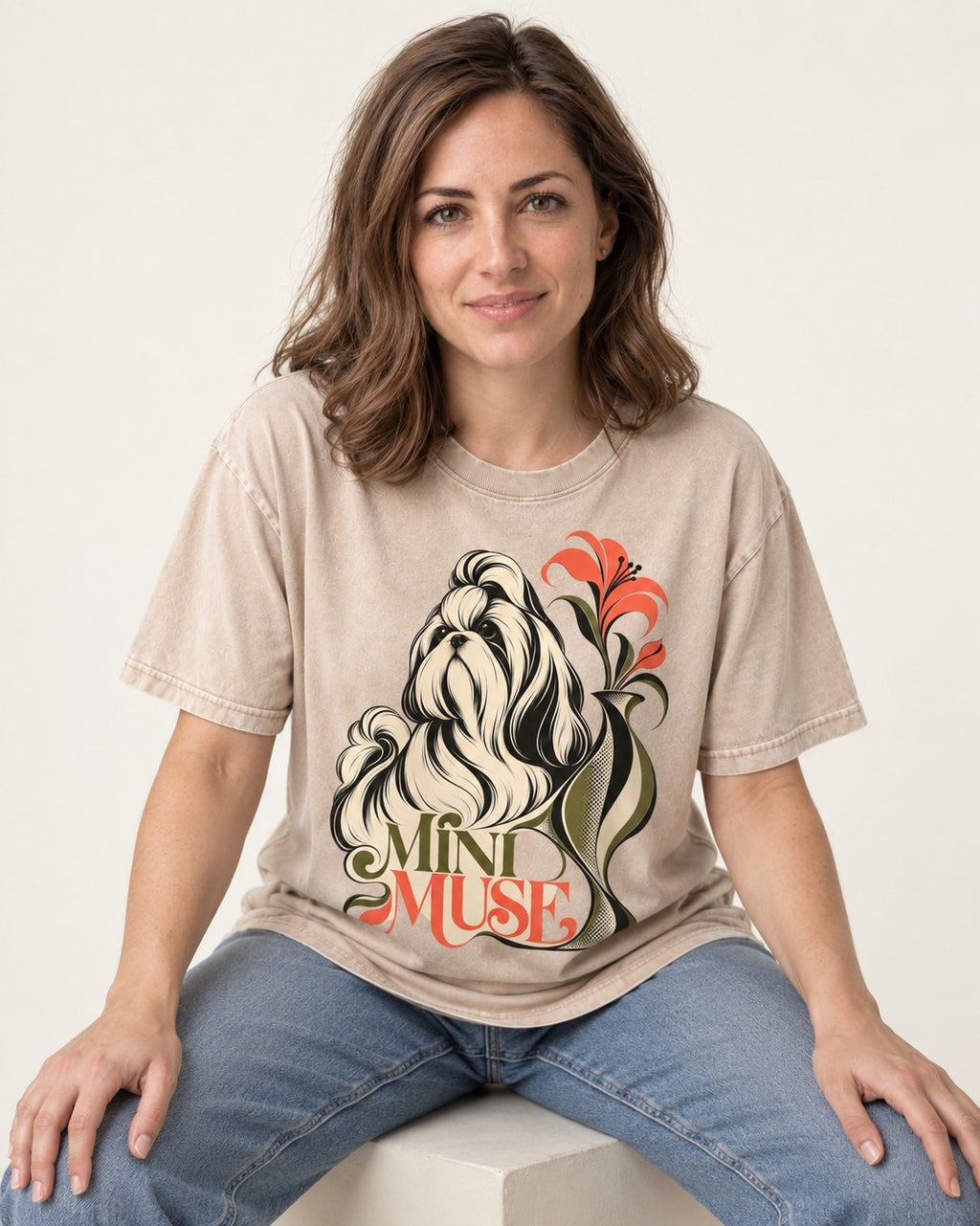 Shih Tzu Mini Muse Washed Tee in Apricot, worn by a seated model