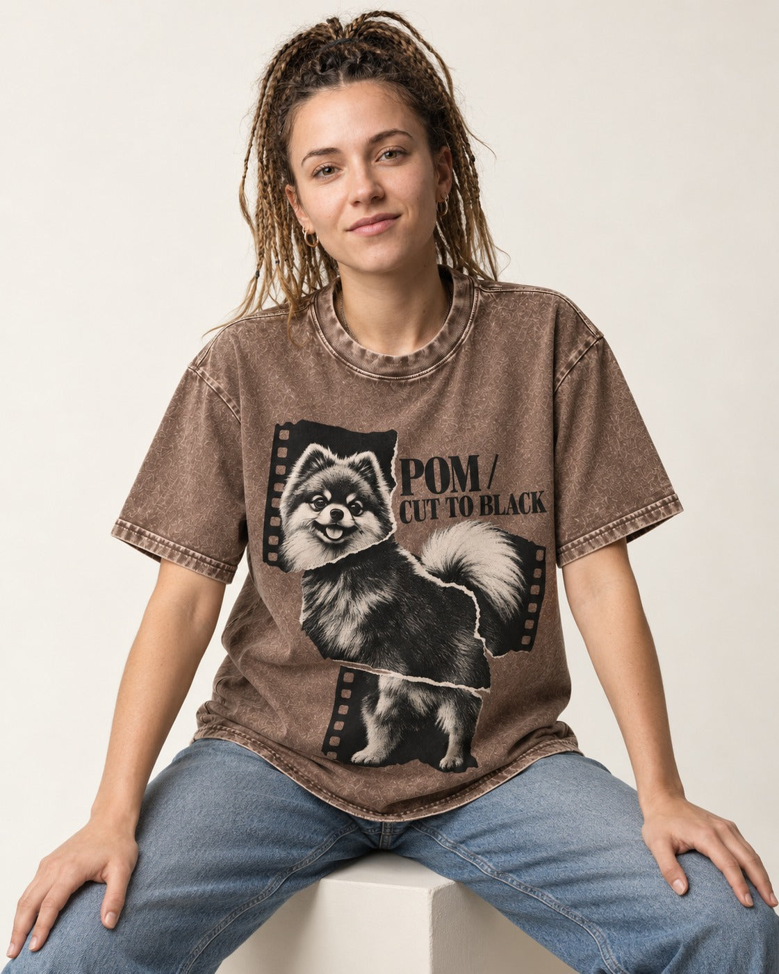 Pomeranian Cut to Black Washed Tee in Coffee, worn by a seated model