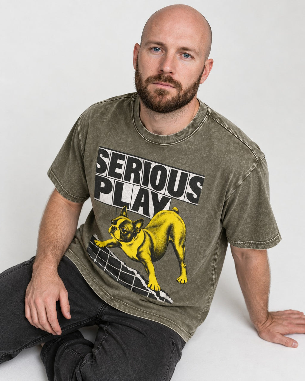 Boston Terrier Serious Play Agility Graphic Washed Tee in Army Green, worn by a seated model
