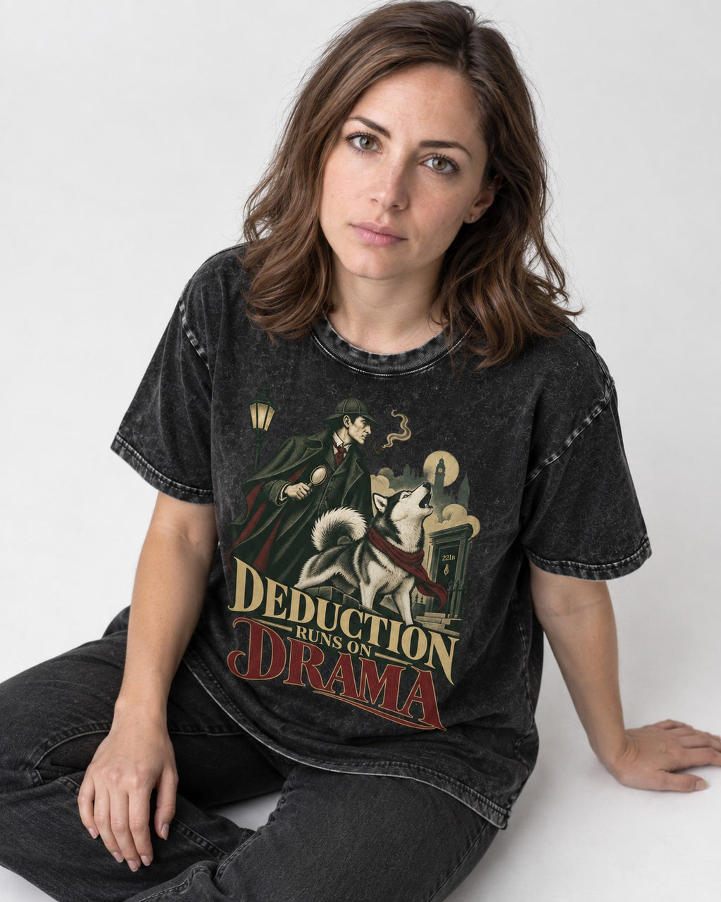 Husky Deduction Runs on Drama Detective Graphic Washed Tee in Black, worn by a seated model
