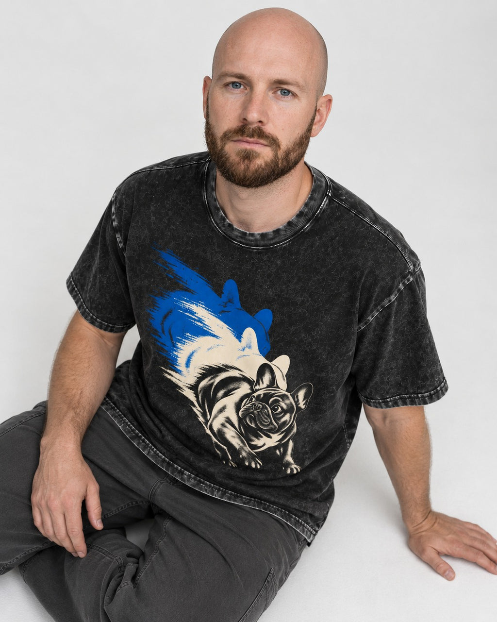 Frenchie Blue Brush Zoomie Graphic Washed Tee in Black, worn by a seated model