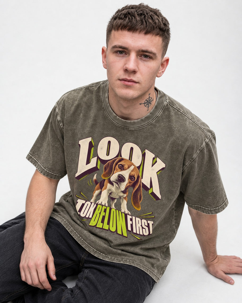 Beagle Look Low Below First Washed Tee in Army Green, worn by a seated model