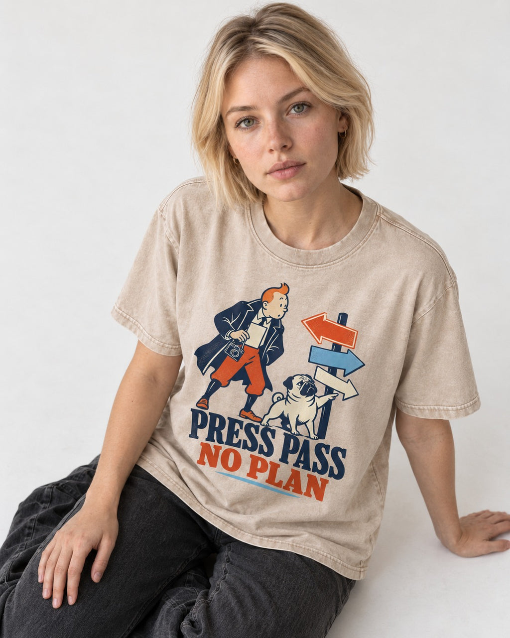 Pug Press Pass No Plan Washed Tee in Apricot, worn by a seated model