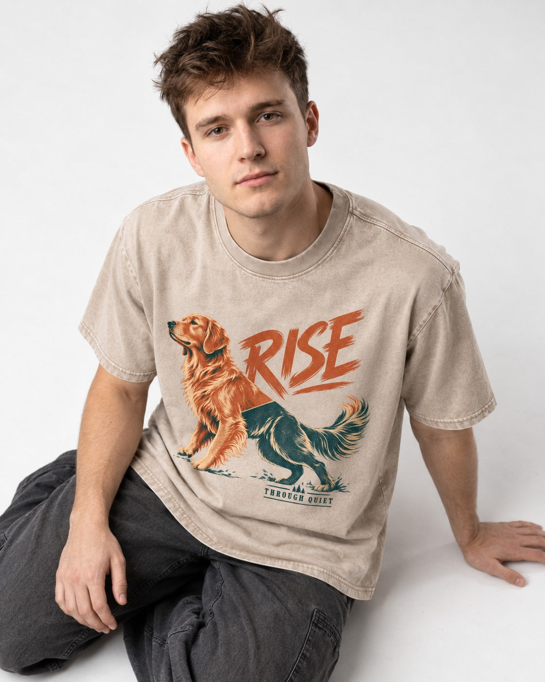 Golden Retriever Rise Through Quiet Washed Tee in Apricot, worn by a seated model