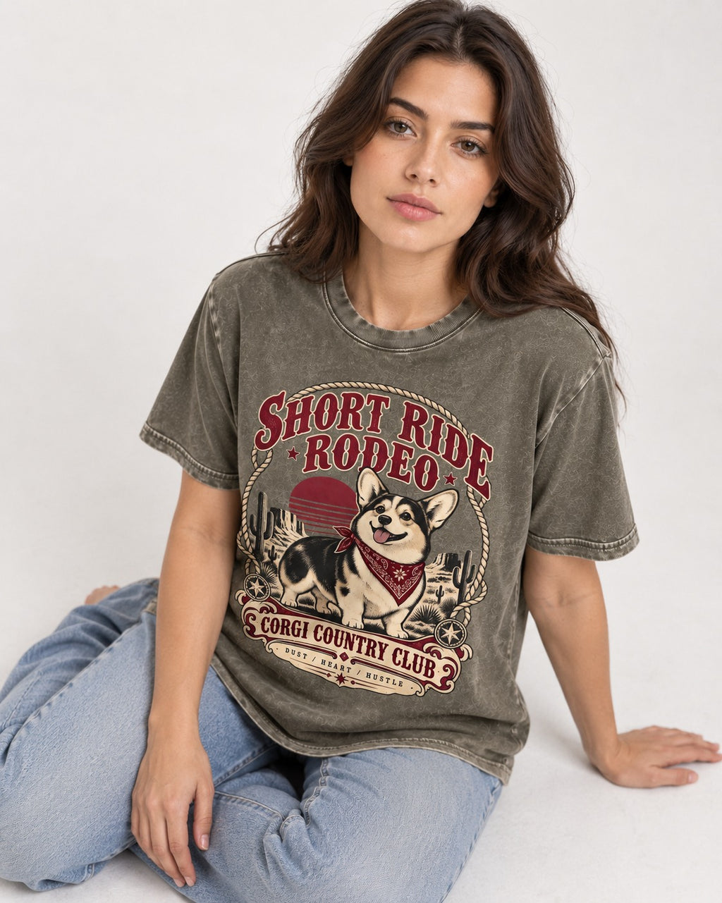 Corgi Short Ride Rodeo Country Club Badge Washed Tee in Army Green, worn by a seated model